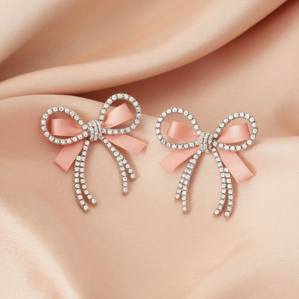 Złote kolczyki w kształcie kokardek